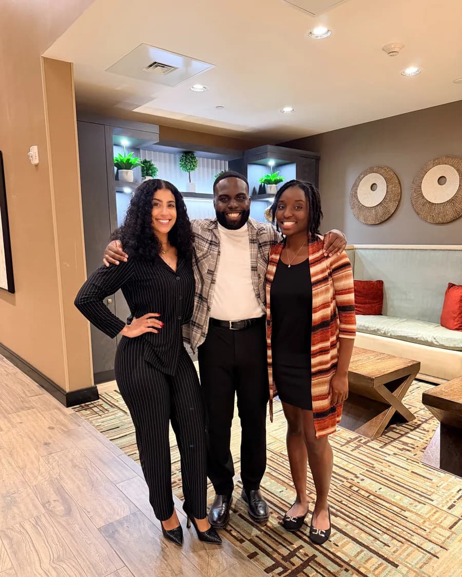 Rossy M. Peralta with two members at a society gathering