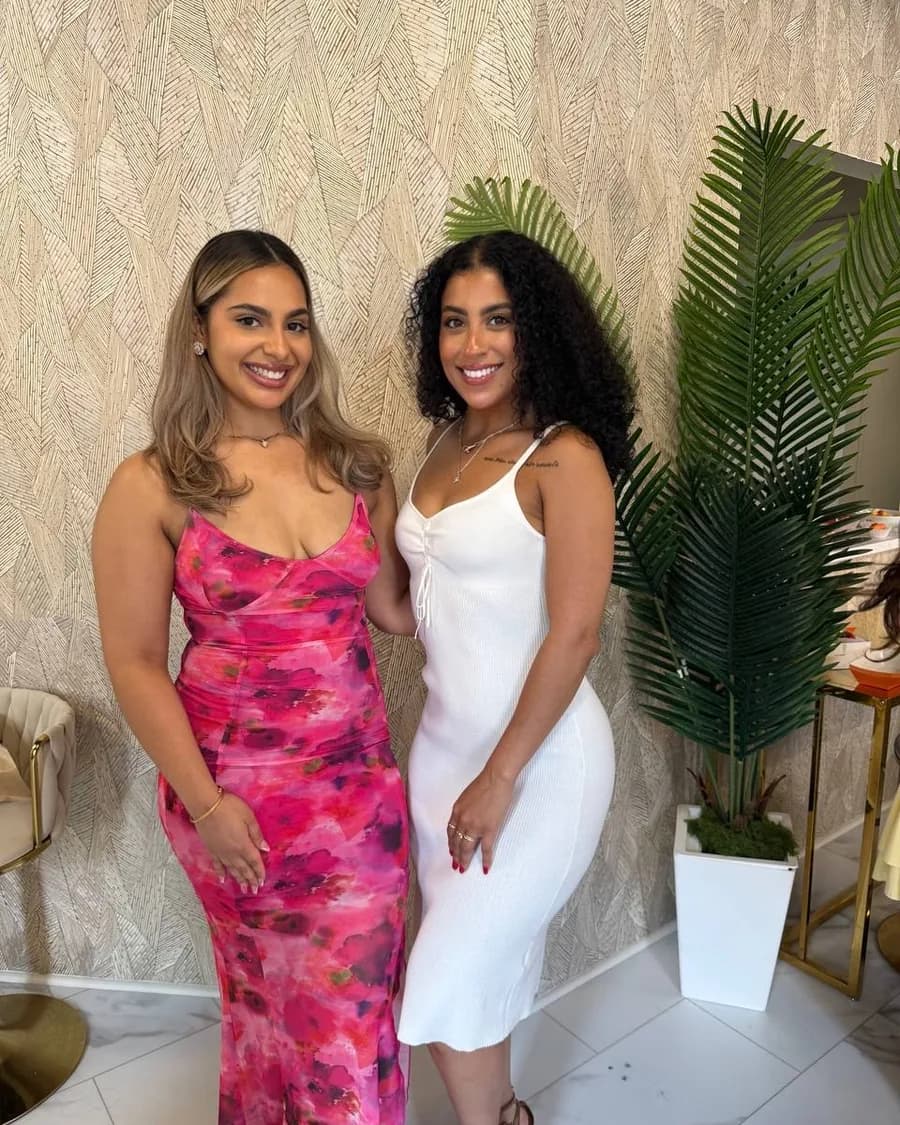Rossy M. Peralta with a member at a society celebration